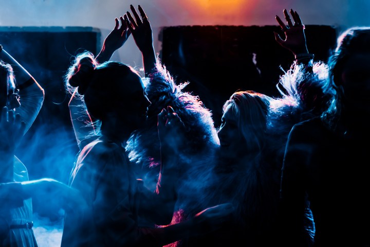 a group of people in a dark room