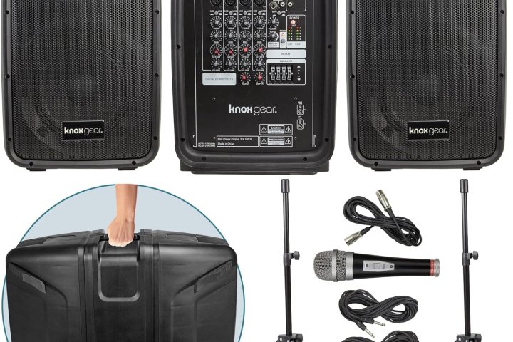 a piece of luggage sitting on top of a speaker