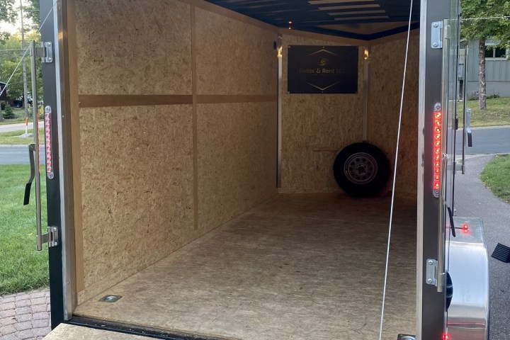 a close up of a small house in a parking lot